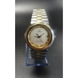 GENTLEMAN'S OMEGA SEAMASTER WRISTWATCH with a circular gold coloured dial with baton hour markers,