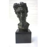 BRONZE MALE PORTRAIT BUST circa 1940s, 40cm high, raised on a substantial marble base Note: most