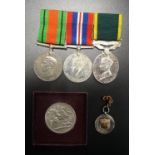 WWII BRITISH DEFENCE AND WAR MEDALS AND A GEORGE VI EFFICIENCY MEDAL (Territorial) named to 'Lt T