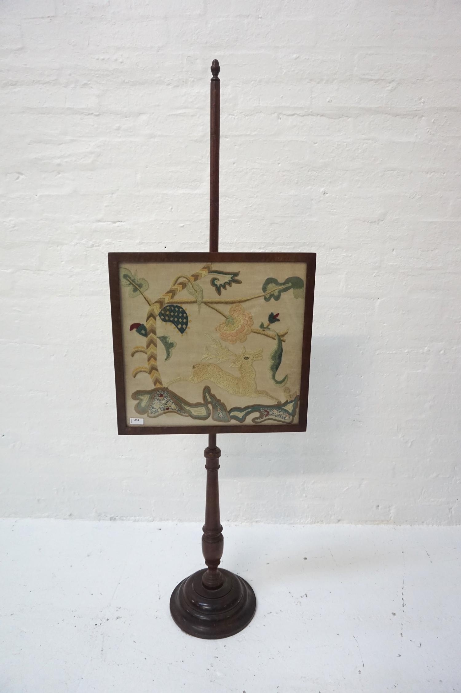 MAHOGANY POLE SCREEN with a square needlework panel depicting a deer, on a turned column and