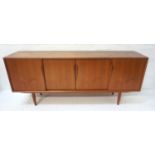 RETRO TEAK DANISH SIDEBOARD with a moulded top above a pair of central sliding cupboard doors