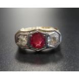 SYNTHETIC RUBY AND DIAMOND THREE STONE RING the central round cut ruby approximately 1ct flanked by