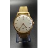 GENTLEMAN'S VINTAGE EIGHTEEN CARAT GOLD CASED OMEGA WRISTWATCH the circular dial with baton hour