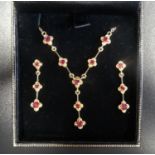 ATTRACTIVE RUBY SET NECKLACE AND MATCHING DROP EARRINGS all in nine carat gold, the necklace with