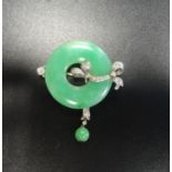 ATTRACTIVE JADE AND DIAMOND BROOCH the ring of green jade with diamond set ribbon detail and further
