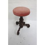 MID VICTORIAN ROSEWOOD PIANO STOOL with a circular adjustable stuffover seat on a tapering turned