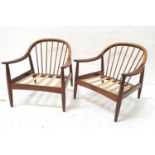 PAIR OF 1960s GREAVES & THOMAS TEAK ARMCHAIRS with arched stick backs above shaped arms, with