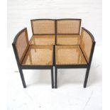 SET OF FOUR ITALIAN DINING CHAIRS with ebonised frames and caned backs and seats, standing on