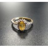 CITRINE AND DIAMOND CLUSTER RING on nine carat gold shank, ring size J