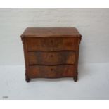 VICTORIAN MAHOGANY SERPENTINE FRONT CHEST of three drawers, raised on front turned feet, 82.5cm high