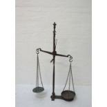 SET OF VICTORIAN CAST IRON SHOP SCALES the central balance arm with two chain link weighing bowls,