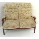 ELM FRAMED TWO SEATER SETTEE with floral covered padding, 121cm wide, and a period floral covered