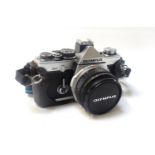 OLYMPUS OM-2 CAMERA with 'F.Zuiko Auto-S 1:1.8 f=50mm lens, numbered 854727, with carrying strap and