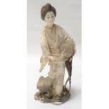 CARVED JAPANESE IVORY OKIMONO circa 1900, depicting a lady in traditional dress carrying and leading