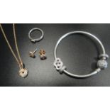 SELECTION OF PANDORA JEWELLERY comprising a Pandora Rose Sparkling Love Knot pendant on chain with