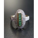ART DECO STYLE EMERALD AND DIAMOND PLAQUE RING the vertical row of square cut emeralds in diamond