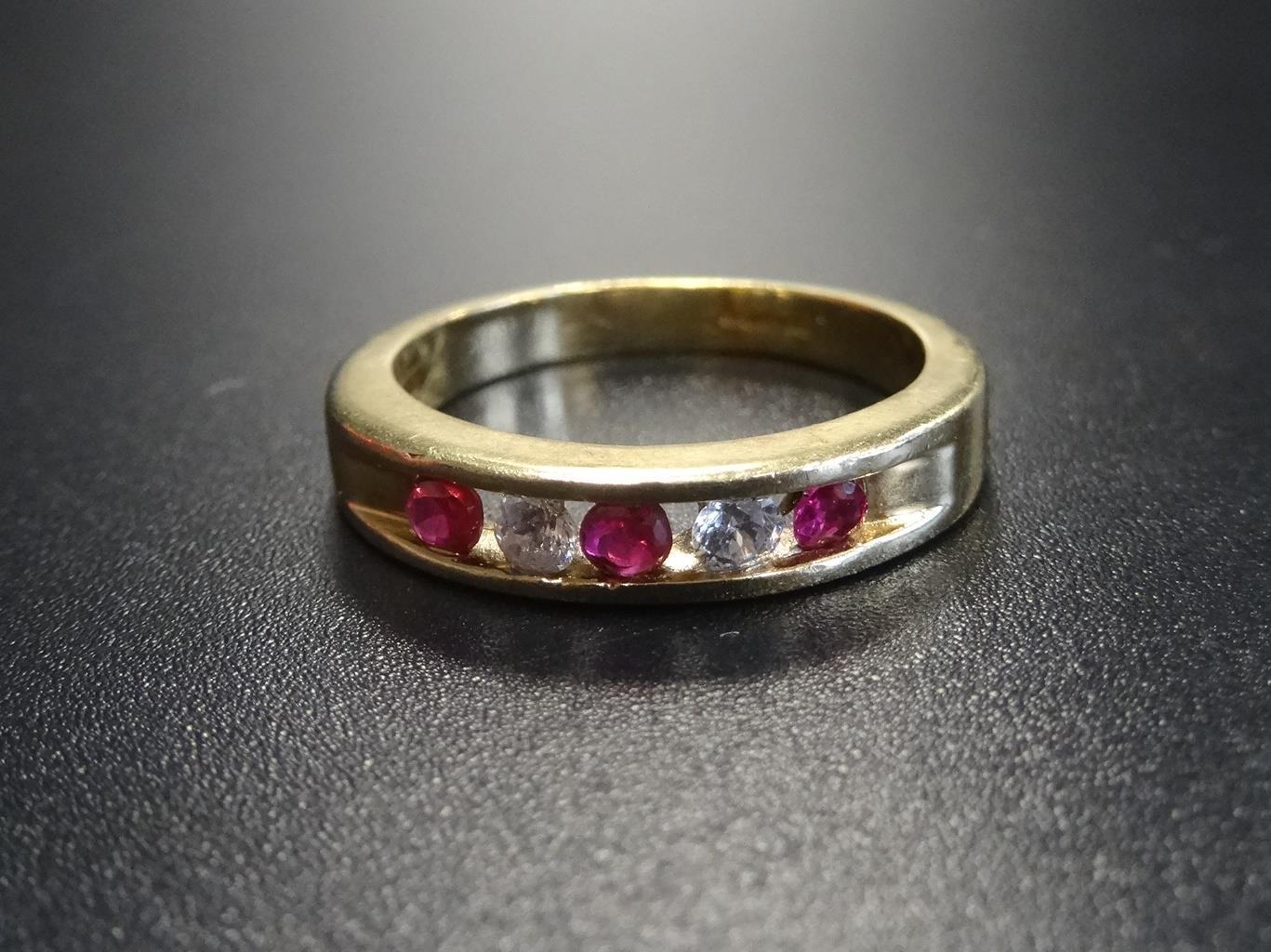 CHANNEL SET RUBY AND CZ FIVE STONE RING in nine carat gold, ring size N-O