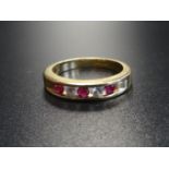 CHANNEL SET RUBY AND CZ FIVE STONE RING in nine carat gold, ring size N-O