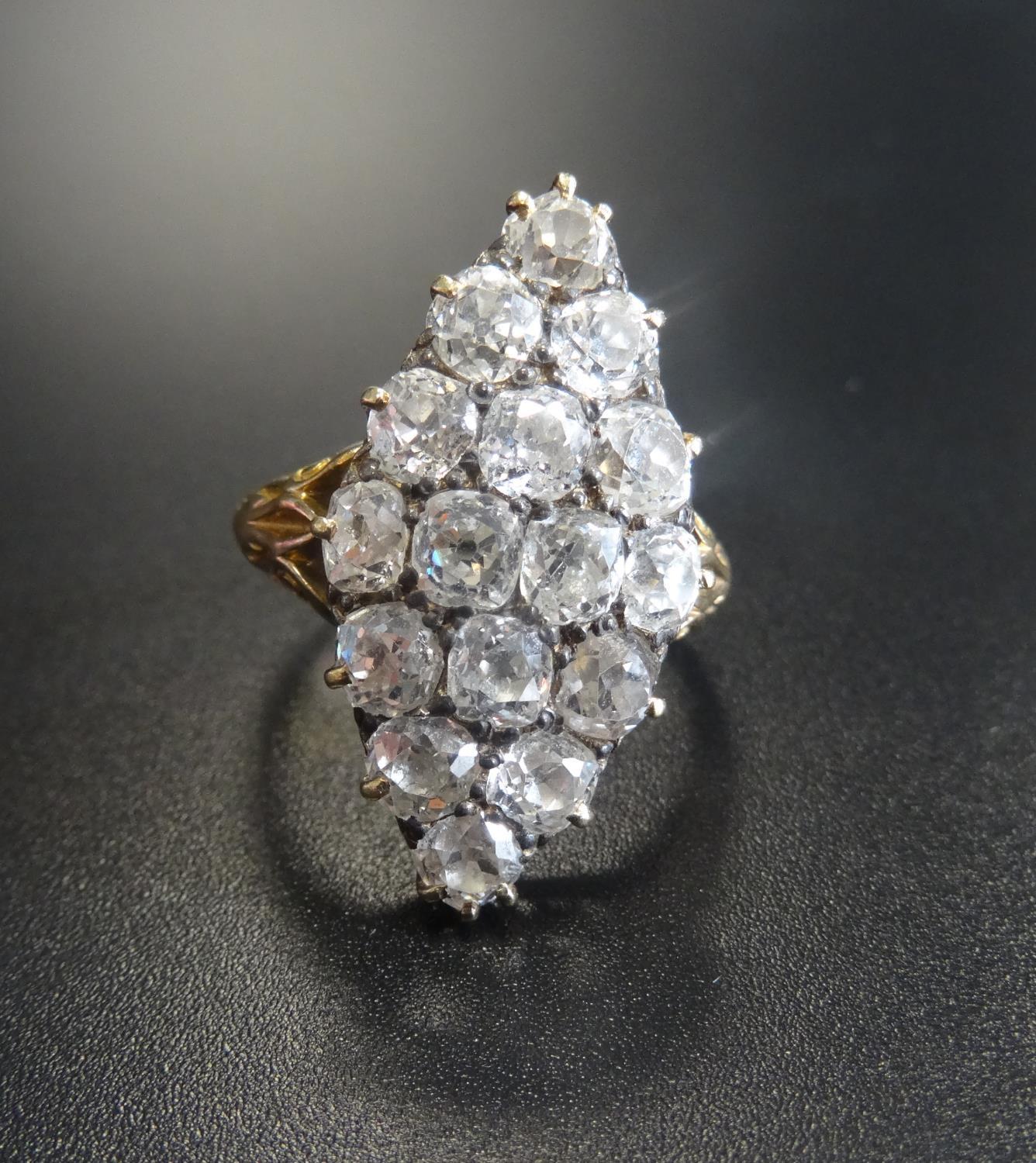 IMPRESSIVE EDWARDIAN DIAMOND CLUSTER RING the sixteen diamonds in lozenge shaped setting totalling
