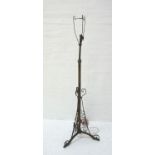 EDWARDIAN BRASS ADJUSTABLE FLOOR LAMP raised on decorative tripod base, approximately 169cm total