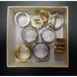 TEN DESIGNER RINGS comprising three Michael Kors logo panel rings, one silver tone, one yellow