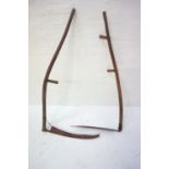 PAIR OF VINTAGE SCYTHES each with a shaped elm shaft with side handles and a curved blade (2)