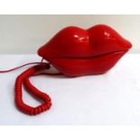 JUICY LIPS TELEPHONE in bright red moulded plastic with an integral key pad