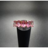 PINK SAPPHIRE FIVE STONE RING the five oval cut sapphires on nine carat gold shank with split