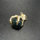 STONE SET NINE CARAT GOLD CLAW PENDANT the bloodstone ball within the gold claw