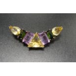 UNUSUAL MULTI GEM SET CRESCENT SHAPED BROOCH the central triangular citrine flanked on each side
