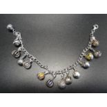 SILVER CHARM BRACELET the silver curb link bracelet with fourteen silver ball charms of various