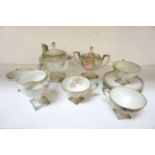 EDWARDIAN PORCELAIN TEA SERVICE with floral decoration and raised on square bases, comprising