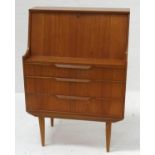 1960s STYLE TEAK BUREAU comprising a pull down panel revealing a central drawer and various