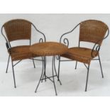 PAIR OF WICKER ARMCHAIRS with shaped backs and scroll arms on metal frames, together with a metal