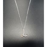 DIAMOND SET 'L' PENDANT the L shaped pendant with seventeen diamonds, in eighteen carat white gold