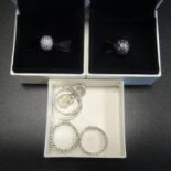 SELECTION OF SILVER PANDORA JEWELLERY comprising four rings: Princess Tiara, Dazzling Daisy Band,