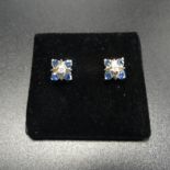 PAIR OF SAPPHIRE AND DIAMOND CLUSTER STUD EARRINGS the central diamond on each in square setting