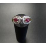 RUBY AND DIAMOND CLUSTER RING each of the two rubies in diamond surround, on nine carat gold