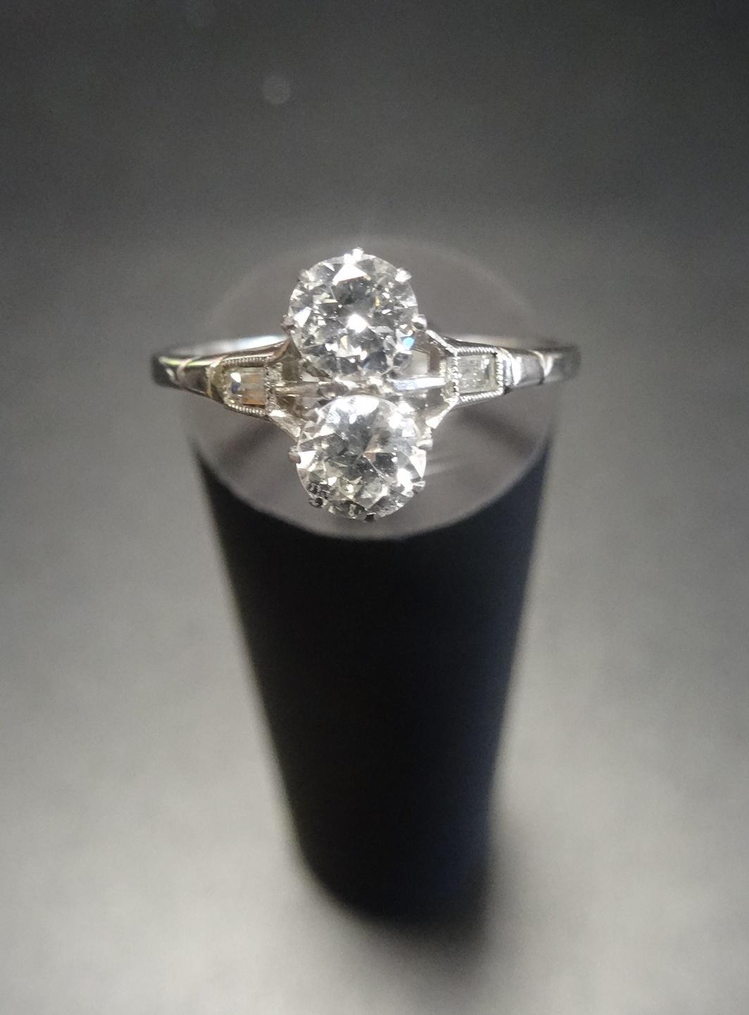 DIAMOND TWO STONE RING the diamonds in unusual vertical setting totalling approximately 0.6cts, on