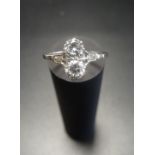 DIAMOND TWO STONE RING the diamonds in unusual vertical setting totalling approximately 0.6cts, on