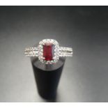 RUBY AND CZ DRESS RING the radiant cut ruby in CZ surround and with further CZ to the split