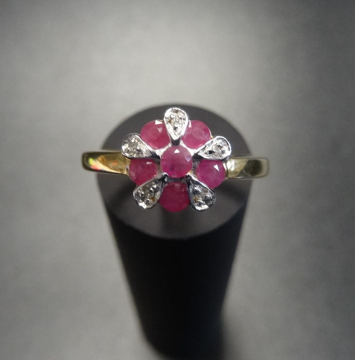 RUBY AND DIAMOND CLUSTER RING on nine carat gold shank, ring size K-L