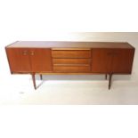 1970s TEAK MCINTOSH SIDEBOARD comprising three drawers with moulded handles flanked by two double