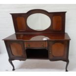 MAHOGANY BREAKFRONT SIDEBOARD with a shaped raised back centered with an oval bevelled mirror,