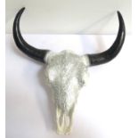 PLASTER SKULL OF A BULL'S HEAD with horns and upper teeth, the front of the head with decorative