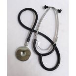 MEDICAL STETHOSCOPE with a shaped chrome ear piece with black rubber buds and black tube body tube