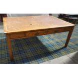 1930s LIGHT OAK DESK with an inset leather effect top above two frieze drawers, standing on tapering