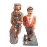 MARTINIQUE CARVED WOOD FIGURE of a local man, 54cm high, together with a plastic figure of a vintage