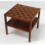 TEAK OCCASIONAL TABLE chequerboard design with lower shelf standing on straight supports, 49cm wide