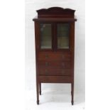 EDWARDIAN MAHOGANY MUSIC CABINET with shaped backrail, the upper glazed cabinet with shelved